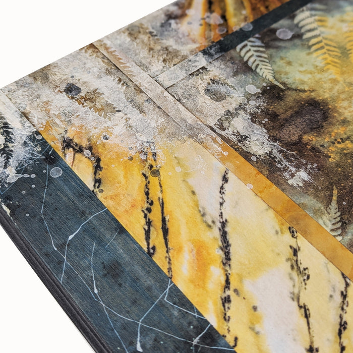 "Sacred Seeds" mixed media, abstracted wall art by Sarah Treanor. 10 x 10" nature inspired cyanotype, eco-print and acrylic artwork with ferns, in earthy blues, yellow golds, grays and creams. Detail shown.