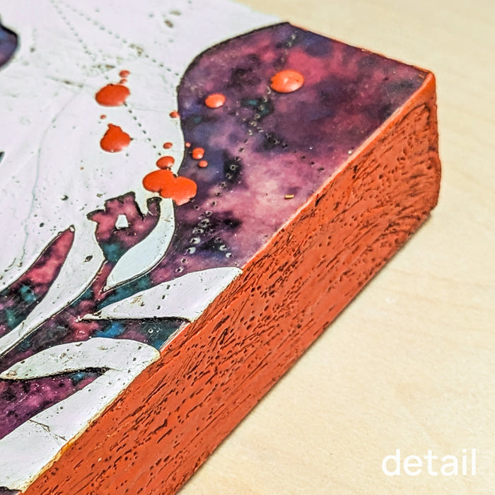 Moondust Flower, mixed media encaustic painting by Sarah Treanor in purple and orange. Side detail shown.