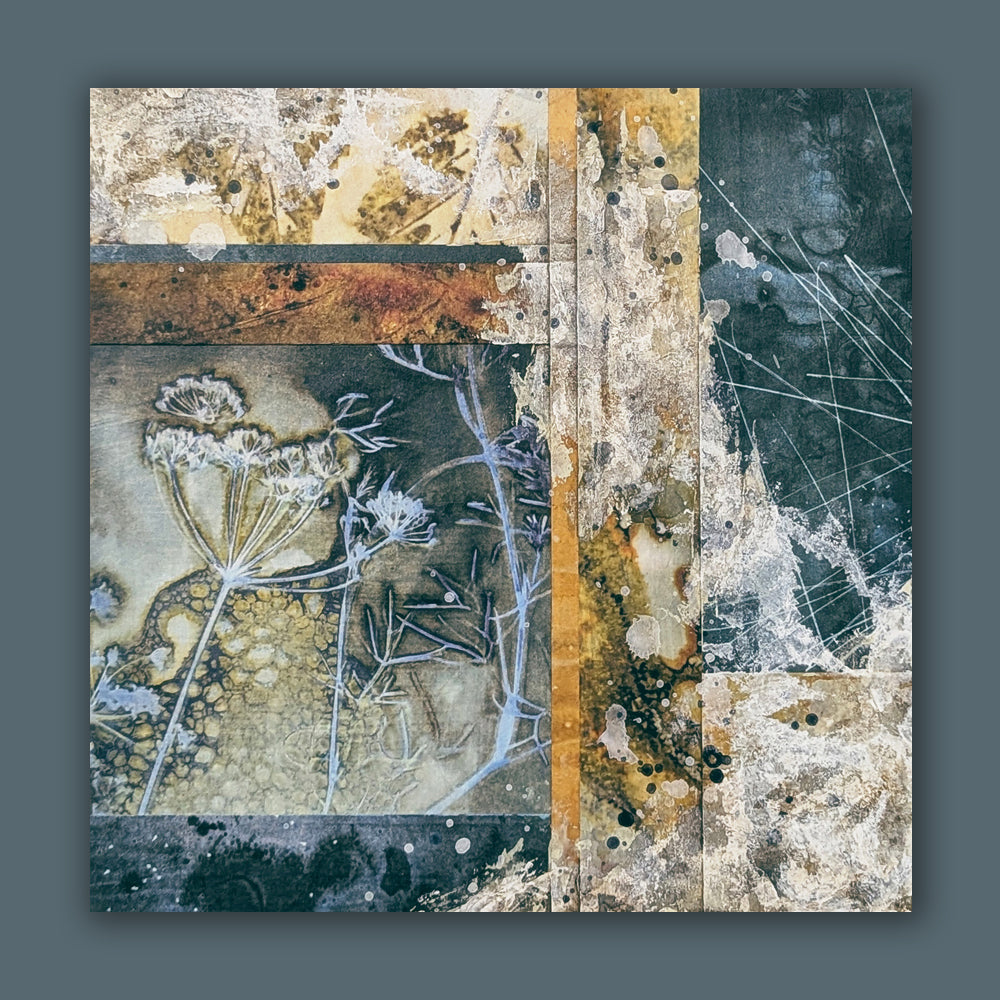 "Sacred Seeds" mixed media, abstracted wall art by Sarah Treanor. 10 x 10" nature inspired cyanotype, eco-print and acrylic artwork with botanical detail, in earthy blues, yellow golds, grays and creams. Shown on blue wall. 