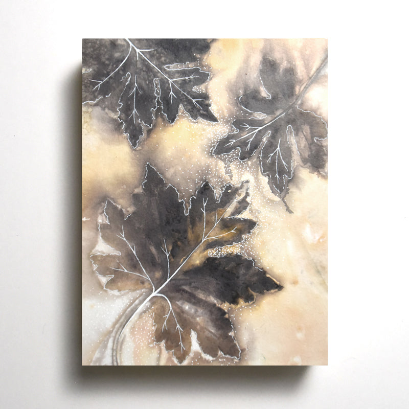 "Summer Song" 8 x 6" eco-printed Red Maple leaf artwork by artist Sarah Treanor.  Shown on wall. 