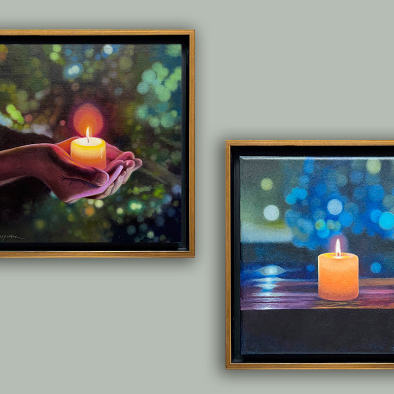 Two framed candle themed paintings by Sharon Cosgrove, showcased together on a pale gray wall. 