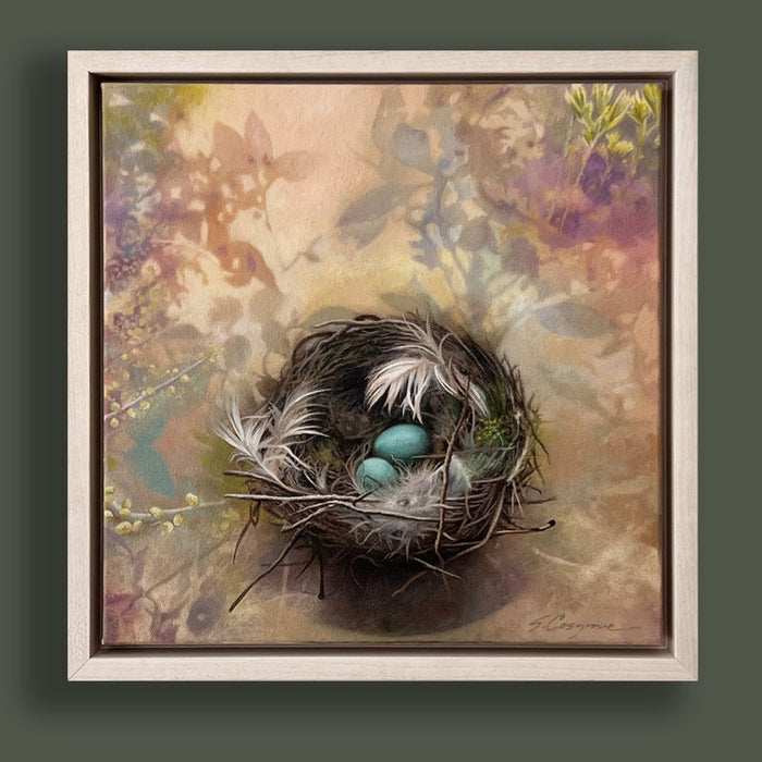 Oil painting depicting a bird's nest with two blue eggs, surrounded by soft botanical. Artwork by Sharon Cosgrove, set in a maple hardwood frame and displayed on dark green wall. 