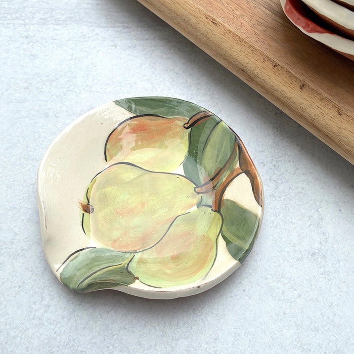 Handmade ceramic spoon rest with pear decoration by Molly Lithgo. 