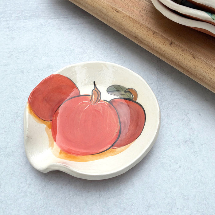 Handmade ceramic spoon rest with apple decoration by artist Molly Lithgo.