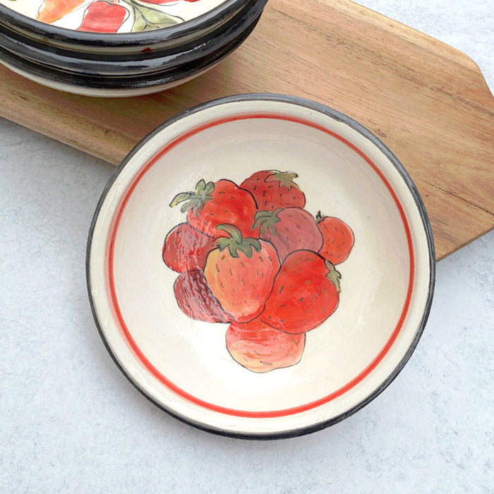 Handmade ceramic bowl with strawberry decoration on the interior by artist Molly Lithgo. 