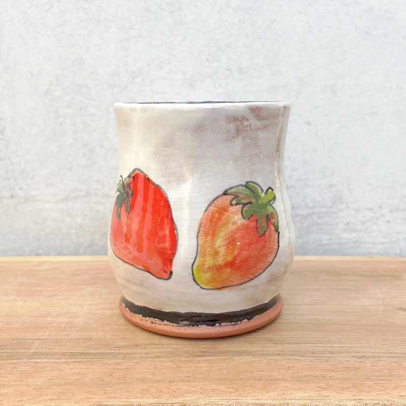 Handmade ceramic mug by NC potter Molly Lithgo. White with strawberry decoration. View 2.