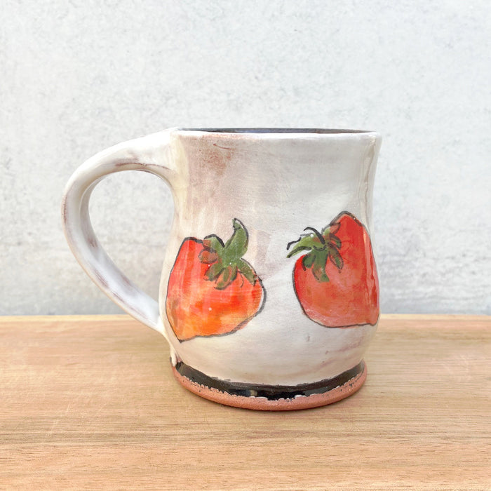 Handmade ceramic mug by NC potter Molly Lithgo. White with strawberry decoration. 