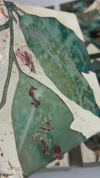 Video of Midnight Embers V mixed media encaustic leaf artwork in rich blues with gold and copper leaf details.